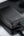 Black portable charger on a reflective surface