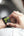 Person using a smartwatch with a blurred background