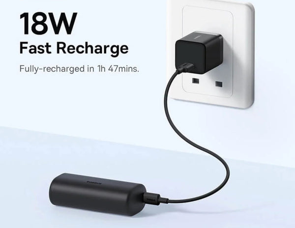 Black charging adapter connected to a wall socket with text indicating fast recharge capability.