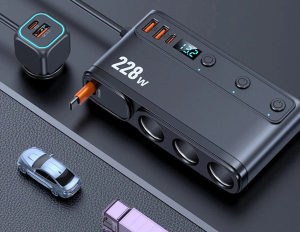 Power bank with multiple ports and a car model on a dark surface