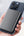 Person holding a smartphone with a Acefast M12 10000mAh Power Bank on a blurred background