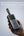 Hand holding a Vyvylabs Power Cube Pro Digital Display Power Bank 20000mAh 100W with Type-C Fast Charging Cable – VBQ10-TN with text about its grip experience and portability.