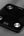 Black digital bathroom scale with silver buttons on a gray background