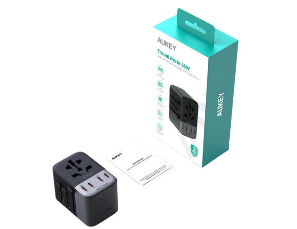 Black travel adapter with AUKEY packaging on a white background