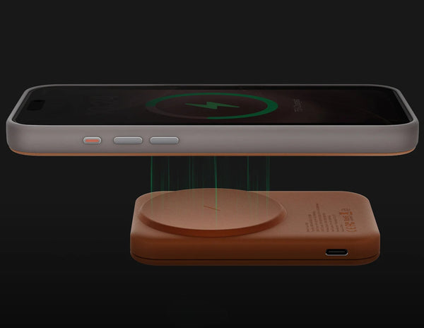 Wireless charging pad with a smartphone on a black background