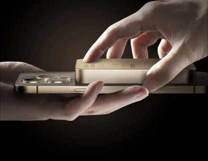 Two hands holding a gold smartphone with a dark background