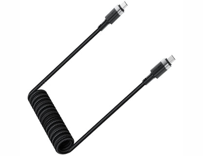 Coiled black cable with multiple connectors on a white background