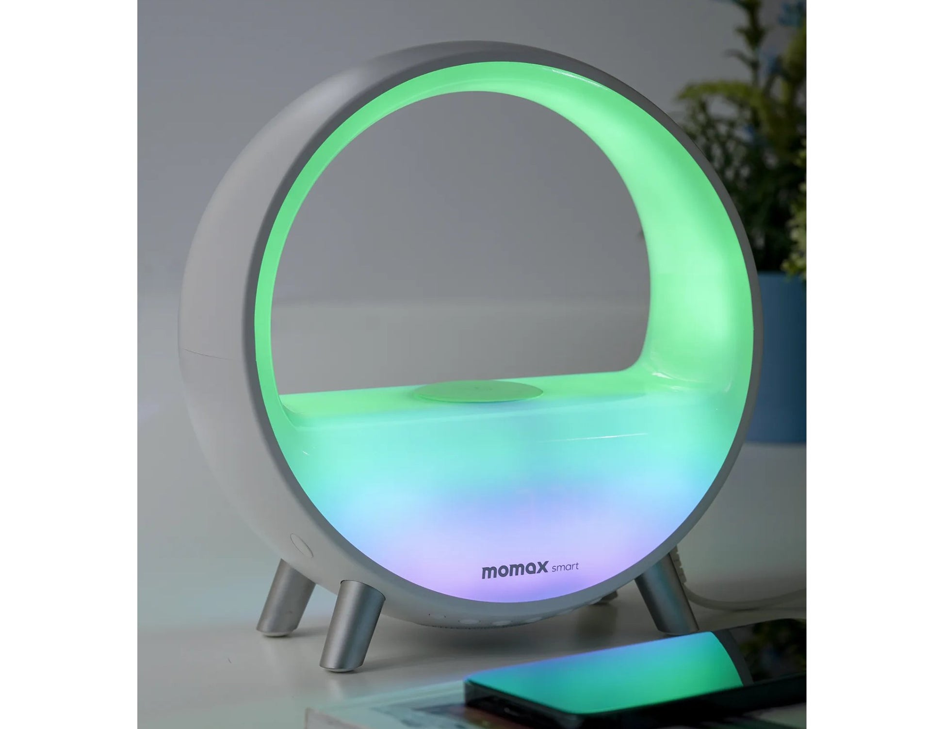 Momax Smart ZENSE IoT LED Clock with Wireless Charging – QC3SWWW with colorful lighting on a white surface, branded 'momax'.
