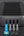 Black power adapter with multiple output ports on a dark background