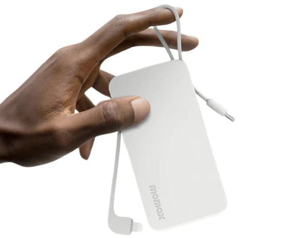 Hand holding a white power bank with a cable on a white background