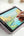 Person drawing on a tablet with a stylus on a light surface