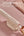 Moxedo 2-in-1 Dynamic Steam Flat Iron MX-DF1011 with detachable water tank on a pink fabric background
