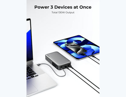 Portable Aukey PB-Y43P Sprint X 130W PD 20000mAh Power Bank – Gray charging a laptop and smartphone with text 'Power 3 Devices at Once' and 'Total 130W Output'.