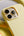 Yellow phone case with camera module on a yellow background