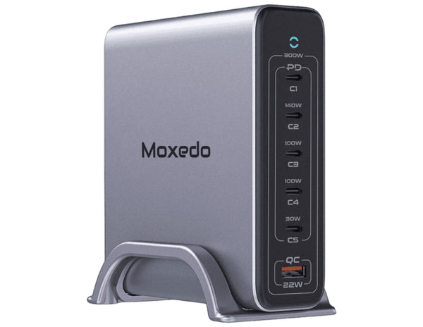 A black Moxedo Volton II PD GaN 300W Desktop Charger with multiple ports and a detachable metal base.