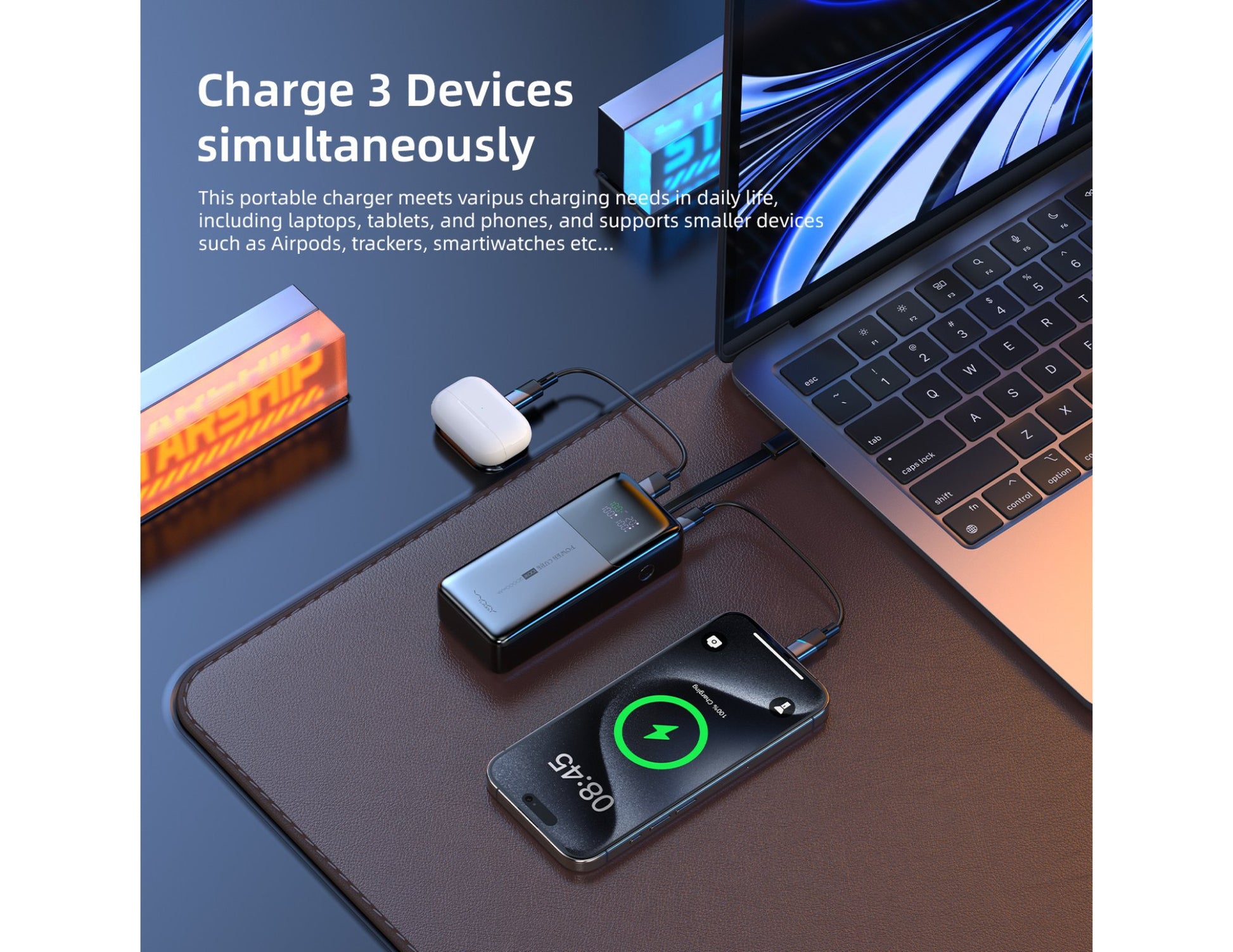 Laptop with multiple devices connected via a Vyvylabs Power Cube Pro Digital Display Power Bank 20000mAh 100W with Type-C Fast Charging Cable – VBQ10-TN on a desk.