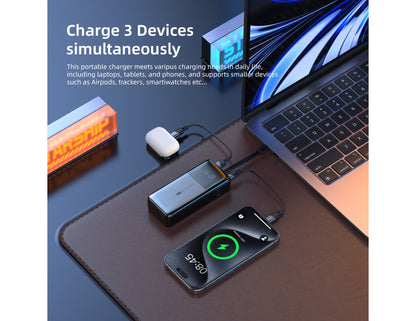 Laptop with multiple devices connected via a Vyvylabs Power Cube Pro Digital Display Power Bank 20000mAh 100W with Type-C Fast Charging Cable – VBQ10-TN on a desk.