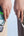 Two hands holding smartphones with UGREEN Nexode 5000mAh 20W Power Bank with Built-in USB-C Connector – PB503, displaying battery charges on screens.
