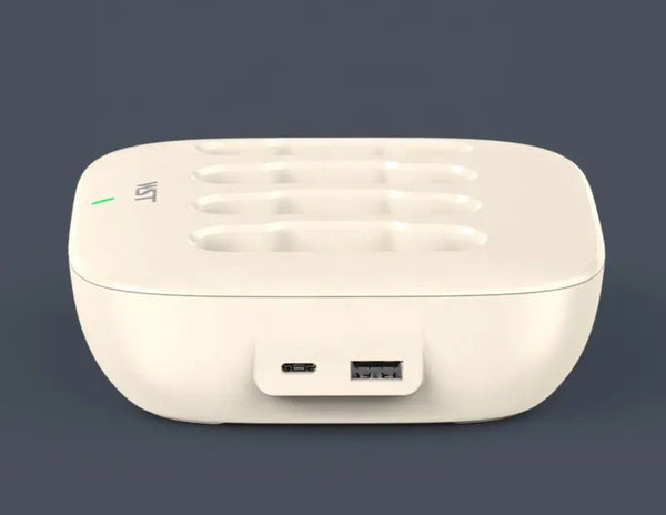 White charging dock with USB port on a dark background