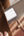 Close-up of a leather bag with a Belkin BoostCharge 3-Port USB-C® Wall Charger with PPS 67W + USB-C Cable – WCC002my2MWH-B6