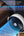 Portable fan with adjustable wind speeds displayed on a blurred background