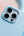 Close-up of a phone case with camera lenses on a light blue background