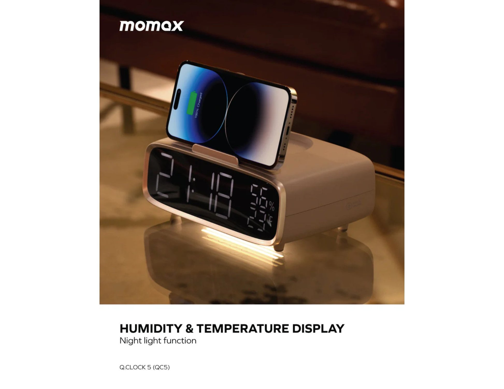 Momax Q.Clock5 Digital Alarm Clock with Wireless Charging – QC5W Showing humidity/temperature display on a reflective surface.