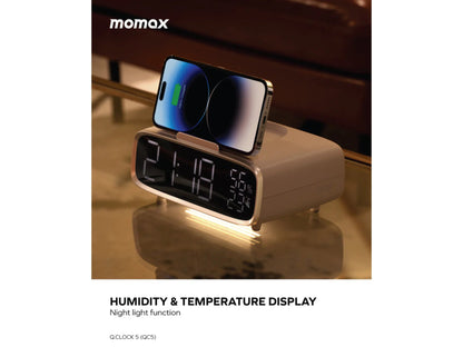 Momax Q.Clock5 Digital Alarm Clock with Wireless Charging – QC5W Showing humidity/temperature display on a reflective surface.