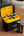 TakTik battery charger with batteries on a wooden surface