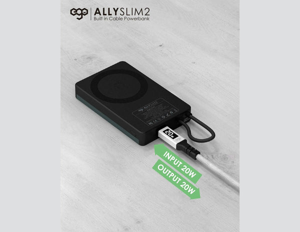 Black power bank with cable on a light gray background