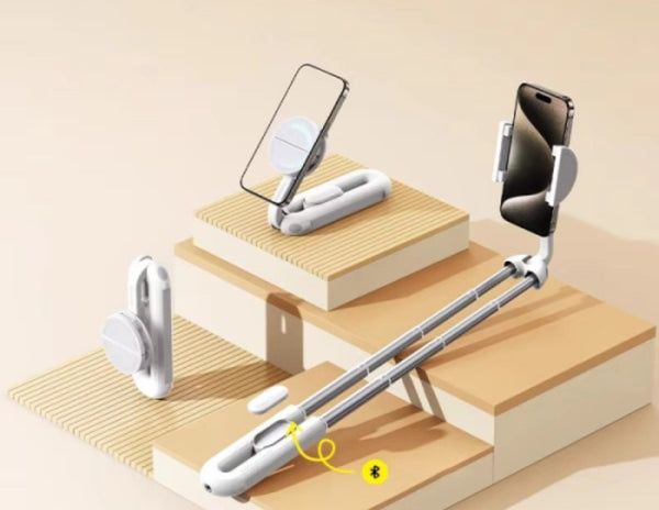 Foldable phone stand on a wooden surface with a neutral background