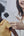 Two women looking at a phone with a white background