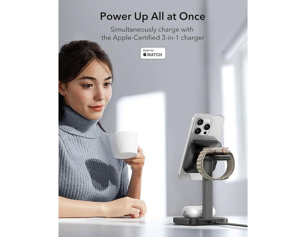 Woman holding a cup with an Apple-certified 3-in-1 charger and phone on a stand in the background.