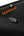 Black surface with water droplets and 'tomtoc' logo in orange.