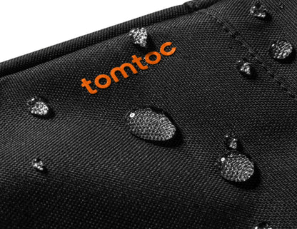 Black surface with water droplets and 'tomtoc' logo in orange.
