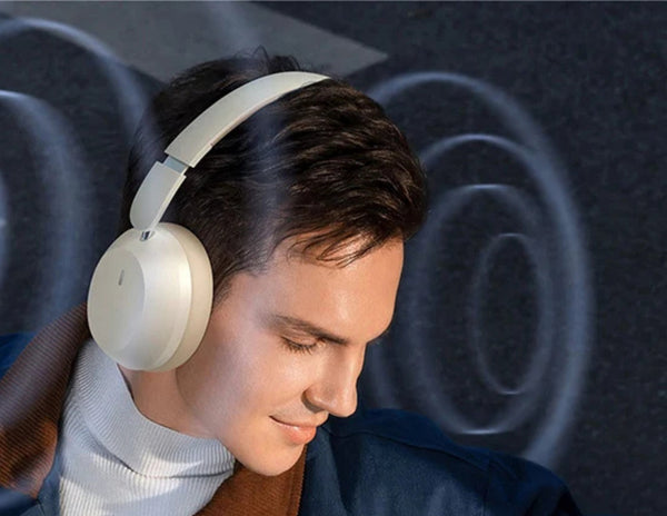 Man wearing white headphones with a dark abstract background