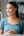 Woman using a smartphone on a bus with Baseus logo in the corner