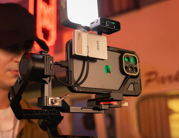 Camera with a Lenova attachment on a blurred background