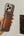 Hand holding a phone with a Pitaka MagSafe Woven Wallet – Magsafe Compatible MWW240 in front of a mirror.