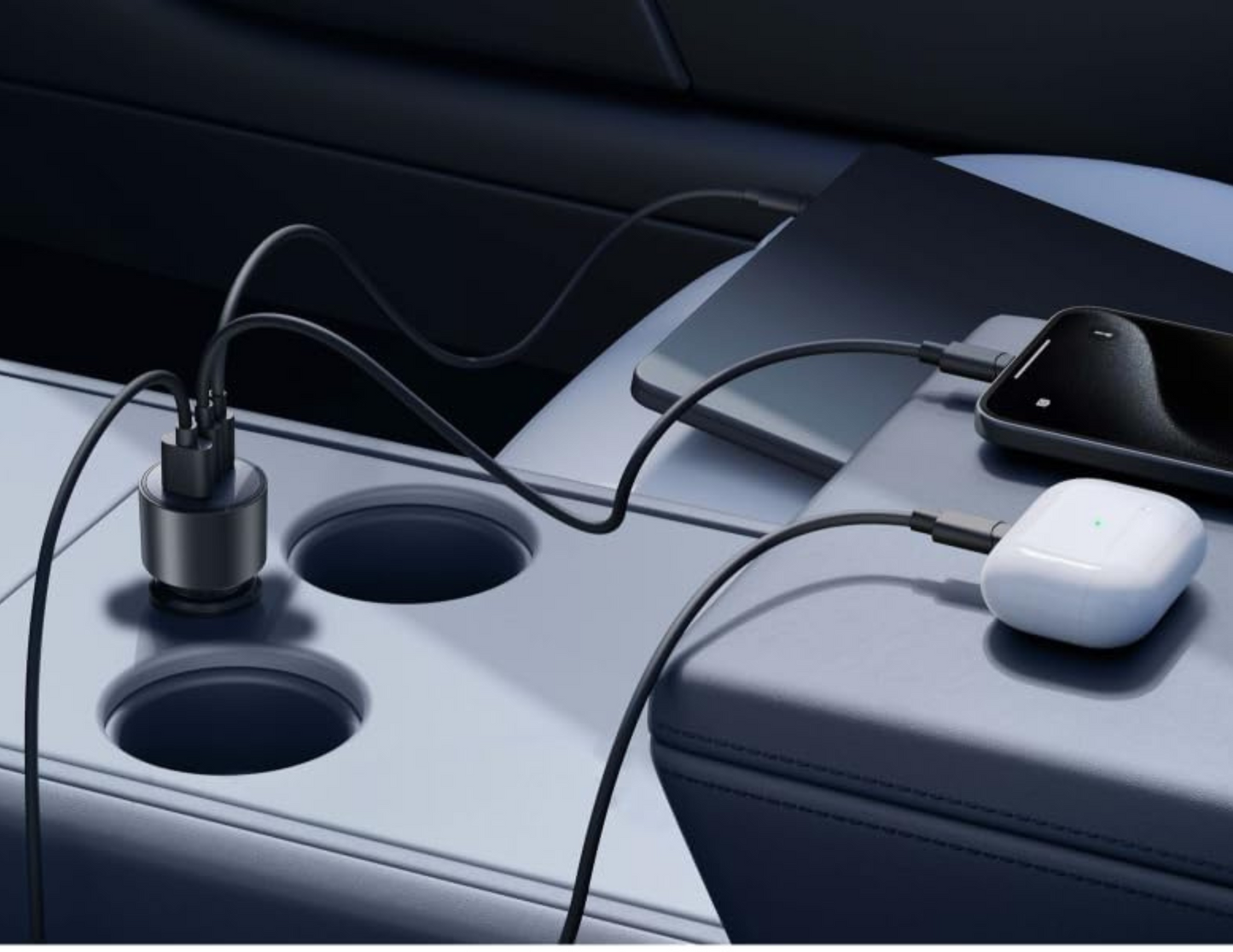 Anker Nano Car Charger B2737HA1 plugged into a car, charging devices.