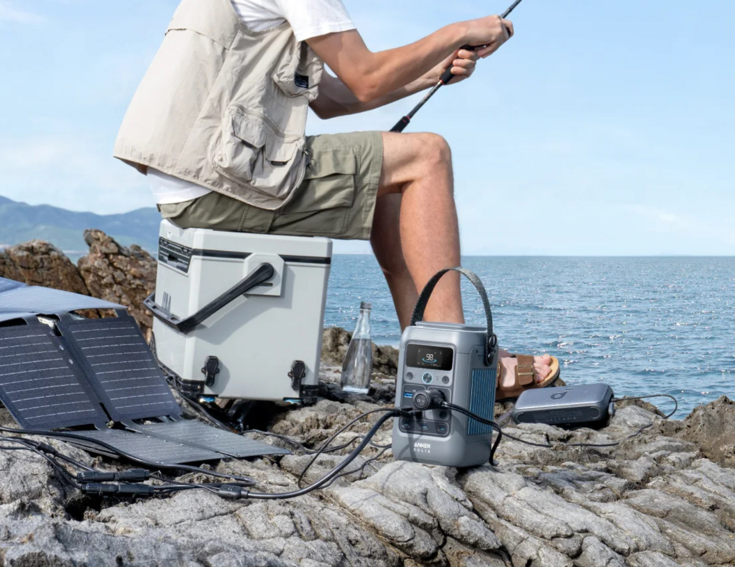 Anker SOLIX C300 DC A17260Z1 with devices connected to its ports in outside fishing.