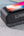 Top view of Anker SoundCore Wakey (A3300221) with a phone charging wirelessly.