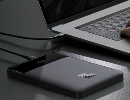 Baseus Blade 100W Power Bank charging a laptop with Type-C PD.