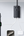Baseus GaN5 Pro Power Strip charging a laptop, smartphone, and tablet simultaneously.
