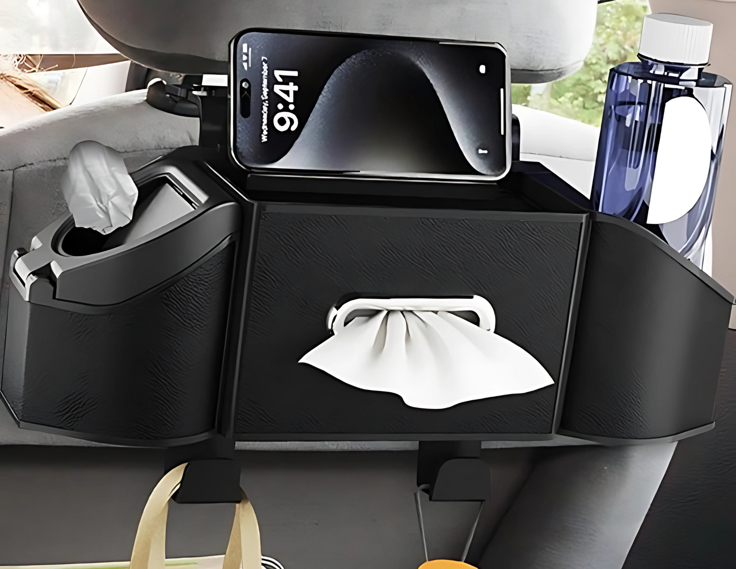 Black car seat organizer with cup holders and tissue box installed in the back seat.