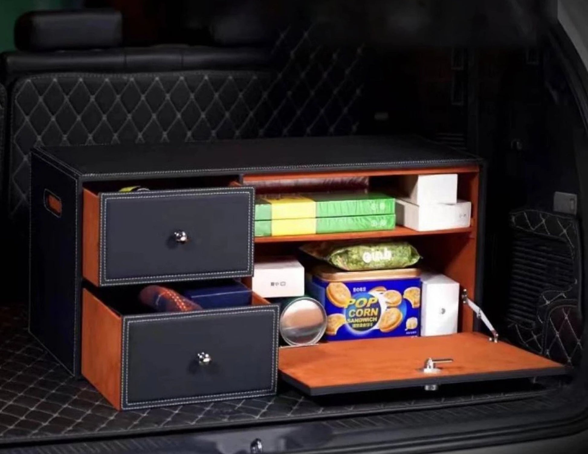 Black car trunk storage box placed inside a vehicle, demonstrating space efficiency.