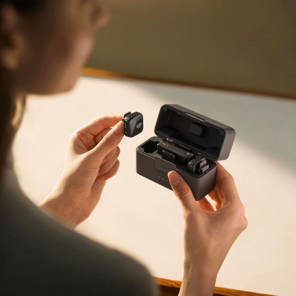 DJI Mic Mini wireless microphone kit with two transmitters, one receiver, and charging case for content creation in Qatar
