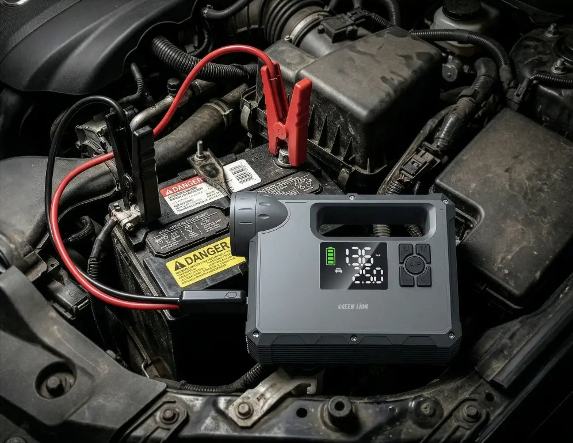 Green Lion JX-84 12V jump starter grey with air compressor flashlight and power bank.