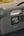 Green Lion JX-84 12V jump starter grey with air compressor flashlight and power bank.