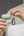 Detachable carabiner attached to the MagEasy Skin AirPods Case.